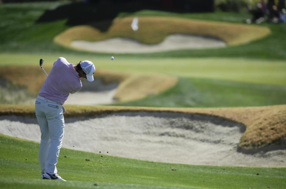 Rory McIlroy hits to the 18th hole during a practice round for the Match Play Championship golf tournament on Tuesday, Feb. 18, 2014 in Marana, Ariz. (AP Photo/Chris Carlson)