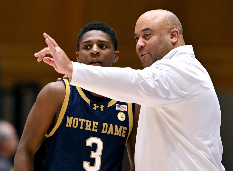 DURHAM, NORTH CAROLINA - FEBRUARY 07: Head coach Micah Shrewsberry talks with Markus Burton #3 of the Notre Dame Fighting Irish during the second half of the game against the Duke Blue Devils at Cameron Indoor Stadium on February 07, 2024 in Durham, North Carolina. Duke won 71-53. (Photo by Grant Halverson/Getty Images)