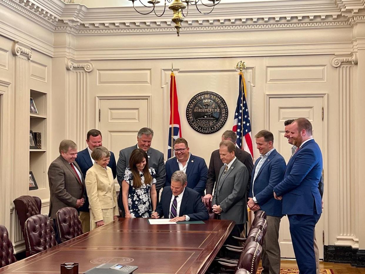 Gov. Bill Lee signs House Bill 0447 that extends scenic protections for the Duck River on Wednesday, April 19, 2023. He is surrounded by locally-elected officials, land owners, activists and business leaders from Maury County, who spent tireless hours promoting and supporting the bill during the 113th General Assembly. (From left) Maury County attorney Doug Murphy, John McEwen, Save the Duck activist Gale Moore, Rep. Scott Cepicky, R-Culleoka, landowner Lisa Brooks, Maury County Commissioner Gabe Howard, broker Dan McEwen, Rep. Joey Hensley, R-Hohenwald, Walker Hoye, Sam Kennedy, III, and Rep. Kip Capley, R-Summertown.