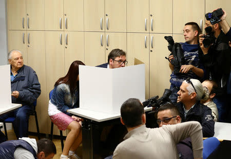 Serbian Prime Minister and presidential candidate Aleksandar Vucic prepares his ballot at a polling station during the presidential election in Belgrade, Serbia, April 2, 2017. REUTERS/Antonio Bronic