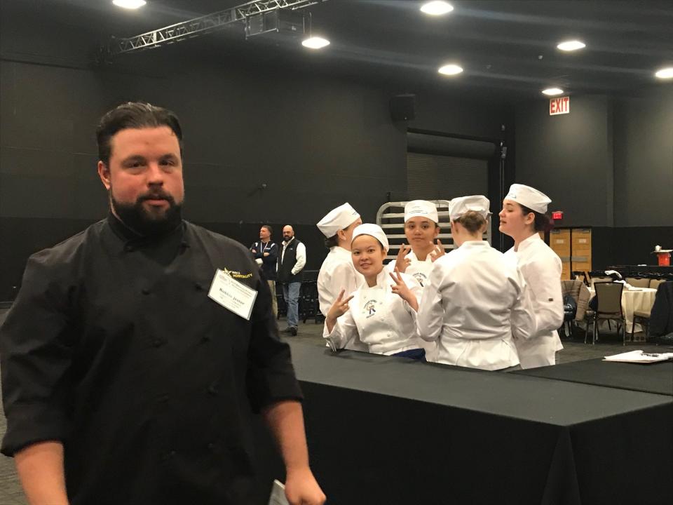 Newark chef Robbie Jester with student chefs from Caesar Rodney High School at the Chase Center at the Riverfront.