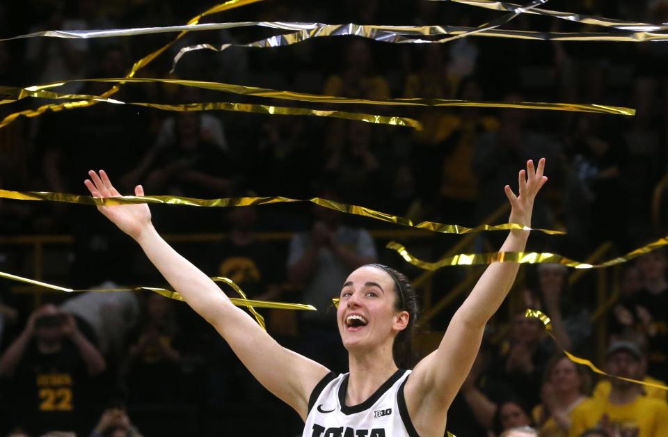 Caitlin Clark reacts after she broke Pete Maravich's all-time NCAA scoring record in the Hawkeyes' 93-83 win.