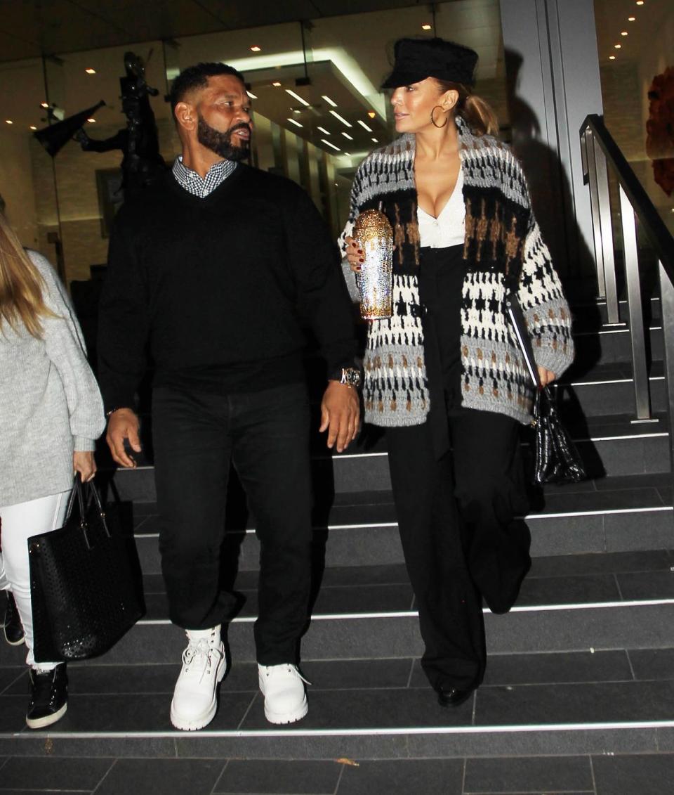 <p>Lopez was photographed on October 23 Los Angeles, California wearing a rather 00s-inspired look. For the outing she teamed a black baker boy style cap with an oversized knitted cardigan, a V-neck white top, high-waisted black flared trousers and black hoop earrings.</p><p>The singer also carried a gigantic coffee cup, bedazzled in gold and silver embellishments. </p>