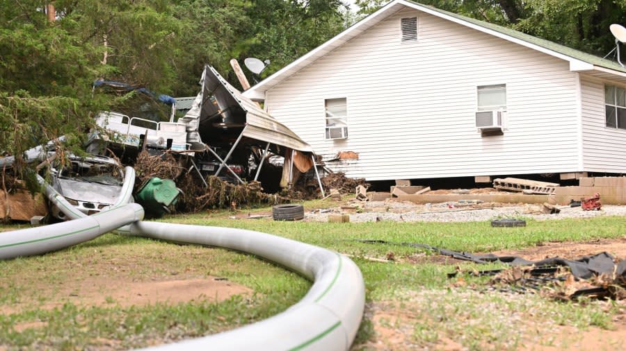 A home near Cane Creek sits off its foundation after severe flooding in Flippin, Ark., on Wednesday, July 17, 2024. (Staci Vandagriff/Arkansas Democrat-Gazette via AP)