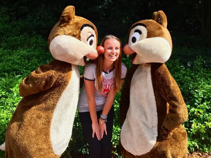 chip and dale kissing jenna on the cheeks at disney world