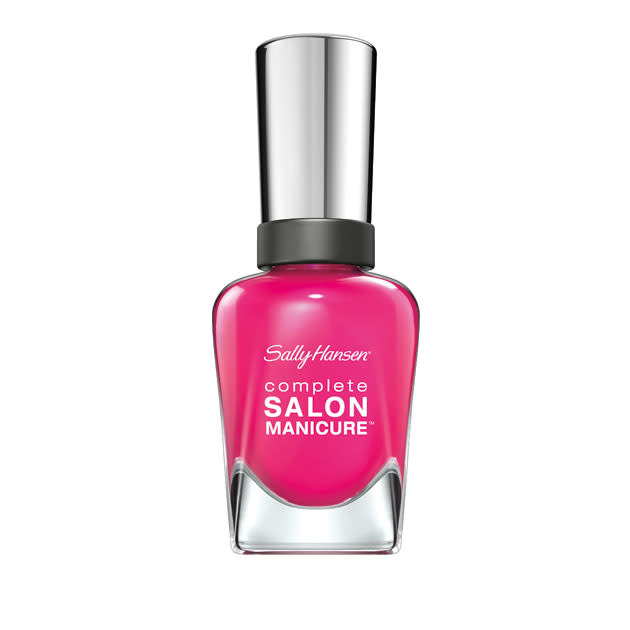 Sally Hansen Complete Salon Manicure in Back to the Fuchsia - £6.99 – <a href="http://www.sainsburys.co.uk/groceries/index.jsp" rel="nofollow noopener" target="_blank" data-ylk="slk:Sainsbury’s;elm:context_link;itc:0;sec:content-canvas" class="link ">Sainsbury’s</a><br><br>Brighten up your nails with this hot pink shade that doubles up as a base and top coat.