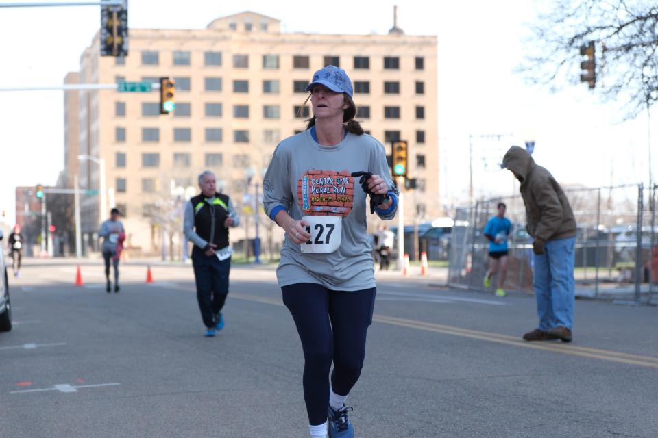 A runner looks over the views Saturday in the 2023 Center City Mural Run in downtown Amarillo.