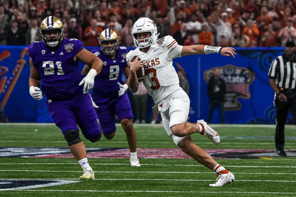 Texas Longhorns quarterback Quinn Ewers (3) runs the ball during the Sugar Bowl College Football Playoff semifinals game against the Washington Huskies at the Caesars Superdome on Monday, Jan. 1, 2024 in New Orleans, Louisiana.