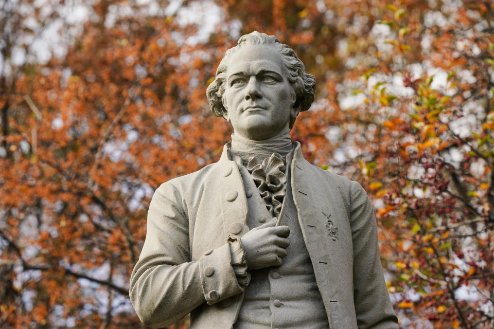 FILE - In this Tuesday, Nov. 10, 2020, file photo, a statue of Alexander Hamilton stands in Central Park in New York. A new research paper takes a swipe at the popular image of Alexander Hamilton as the abolitionist founding father, citing evidence that he was a slave trader and owner himself. (AP Photo/Frank Franklin II, File)