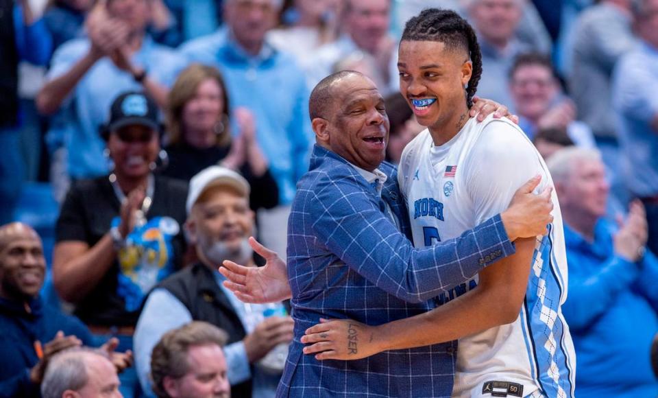 North Carolina’s Armando Bacot (5) gets a hug from coach Hubert Davis as he leaves the game with 14 points in the Tar Heels’ 84-51 victory over Noter Dame, and Bacot’s final home game on Tuesday, March 5, 2023 at the Smith Center in Chapel Hill, N.C.