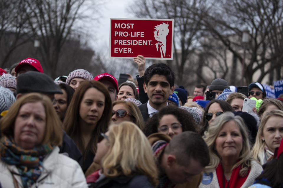 FILE - In this Jan. 24, 2020, file photo, supporters listen as President Donald Trump speaks during the annual "March for Life" rally on the National Mall in Washington. Anti-abortion leaders across America were elated a year ago when Donald Trump became the first sitting U.S. president to appear in person at their highest-profile annual event, the March for Life held every January. The mood is more sober now — a mix of disappointment over Trump’s defeat and hope that his legacy of judicial appointments will lead to future court victories limiting abortion rights. (AP Photo/ Evan Vucci, File)
