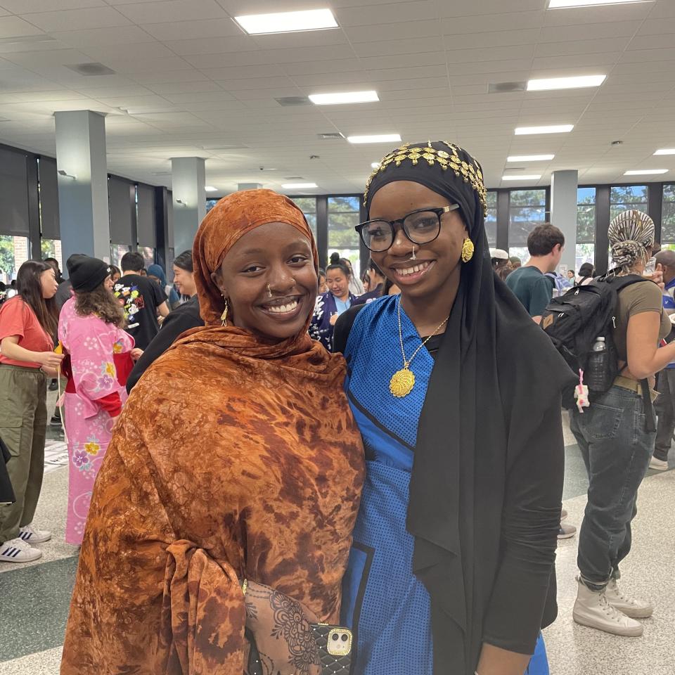 Khadija Hassan (left) and Faay Muuya model East African outfits.