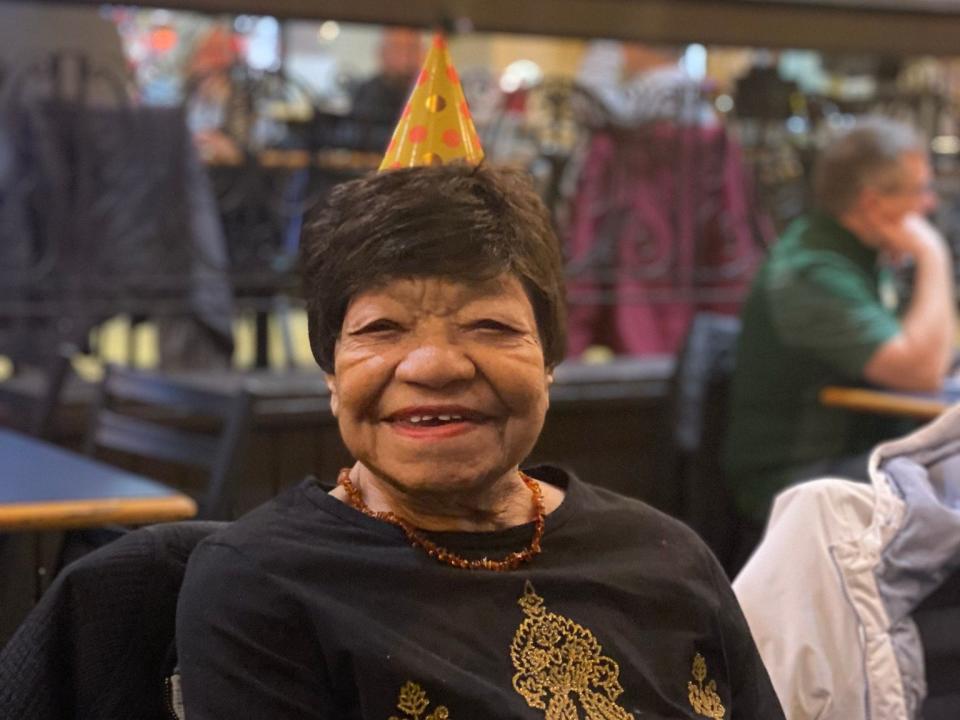 Pearl Taylor wearing a party hat at her 102nd birthday.