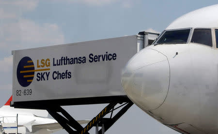 A container of Lufthansa Catering Service Sky Chefs is docked to an airplane of German Airline Lufthansa at Frankfurt airport, Germany, July 28, 2008. REUTERS/Alex Grimm/File Photo