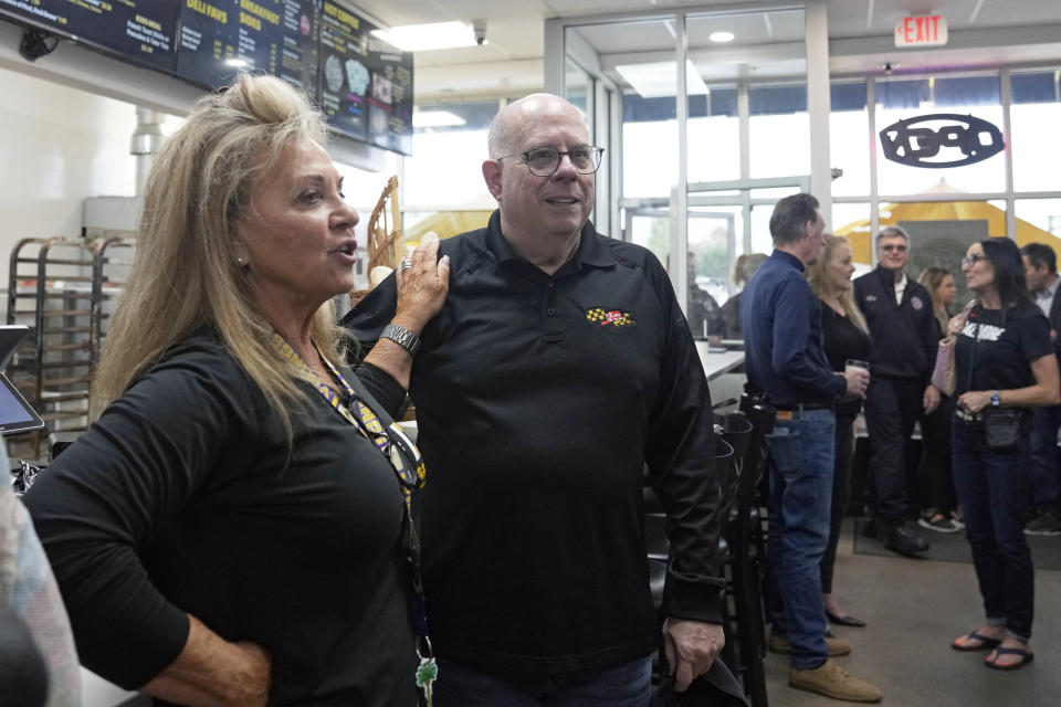 Former Maryland Gov. Larry Hogan, center, talks with Janet DePaola, left, of DePaola's Bagel and Brunch in Stevensville, Md., Friday, April 12, 2024, as he campaigns for the U.S. Senate. (AP Photo/Susan Walsh)