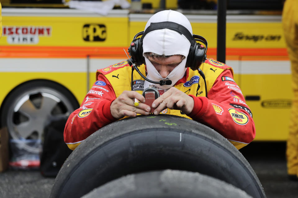 Tires for driver Brad Keselowski are checked during the NASCAR Cup Series auto race Sunday, May 17, 2020, in Darlington, S.C. (AP Photo/Brynn Anderson)