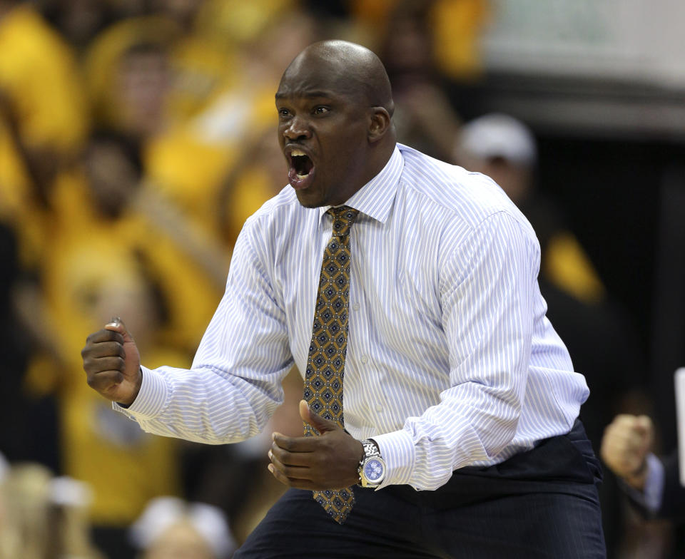 Missouri associate head coach Tim Fuller reacts to a score during the second half of an NCAA college basketball game against Hawaii, Saturday, Nov. 16, 2013, in Kansas City, Mo. Missouri won 92-80. (AP Photo/Ed Zurga)