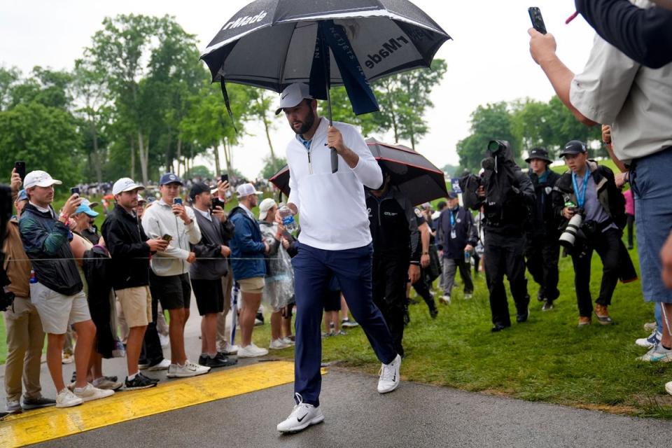 Scottie Scheffler walks to 11th hole after returning to Valhalla (AP)