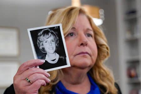 Nassau County District Attorney Anne Donnelly holds a photo of Diane Cusick