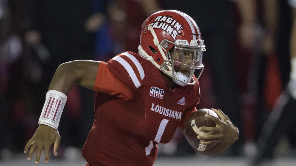 Louisiana-Lafayette quarterback Levi Lewis (1) runs during an NCAA football game against Coastal Carolina on Wednesday, Oct. 14, 2020 in Lafayette, La. (AP Photo/Matthew Hinton)