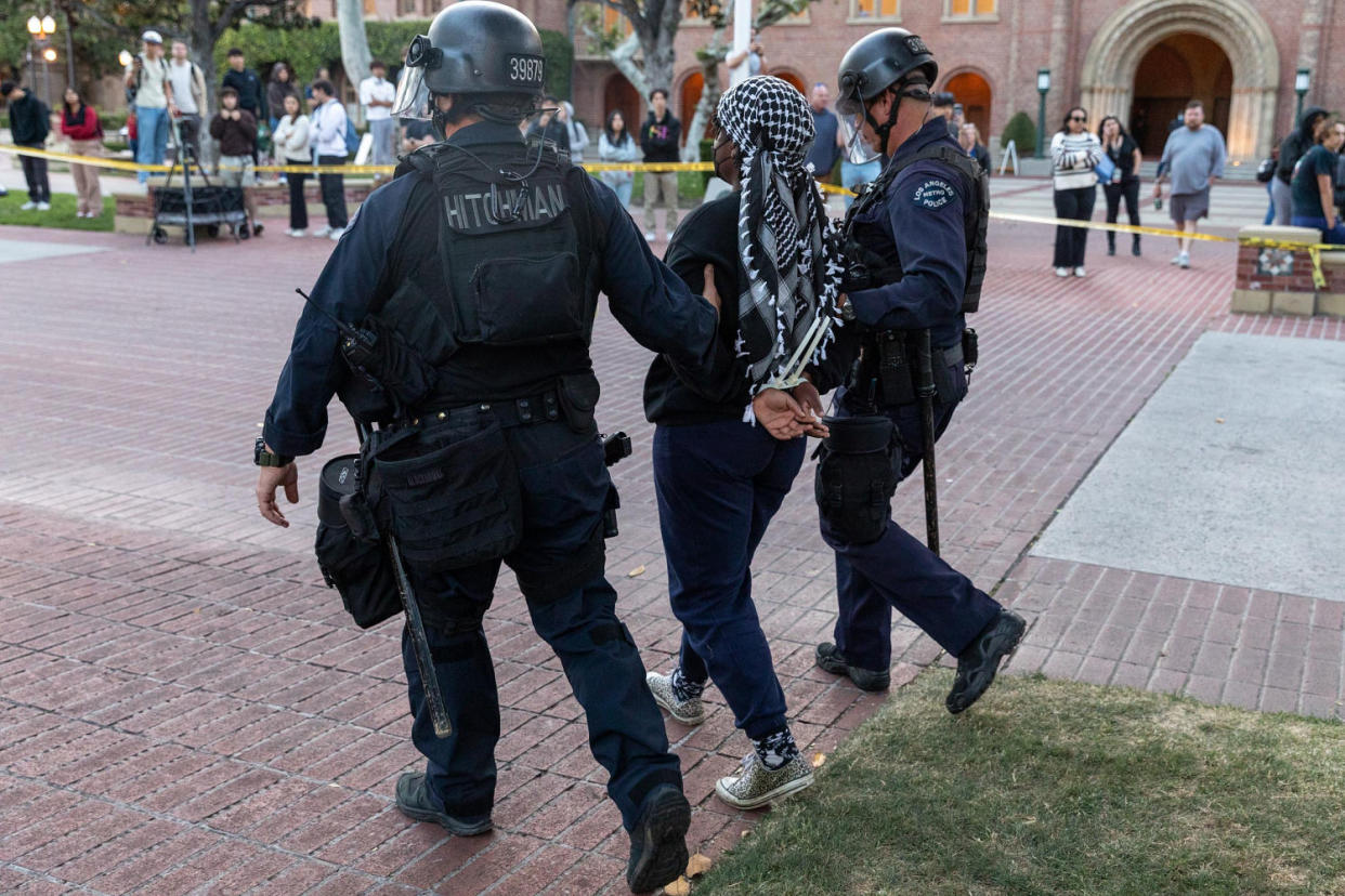 Members of the law enforcement and police officers intervene the Pro-Palestinian student protesters at University of Southern California  ( Grace Hie Yoon / Anadolu via Getty Images)