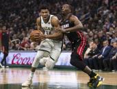 Jan 15, 2019; Milwaukee, WI, USA; Milwaukee Bucks forward Giannis Antetokounmpo (34) drives to the basket against Miami Heat center Bam Adebayo (13) during the second quarter at Fiserv Forum. Mandatory Credit: Jeff Hanisch-USA TODAY Sports