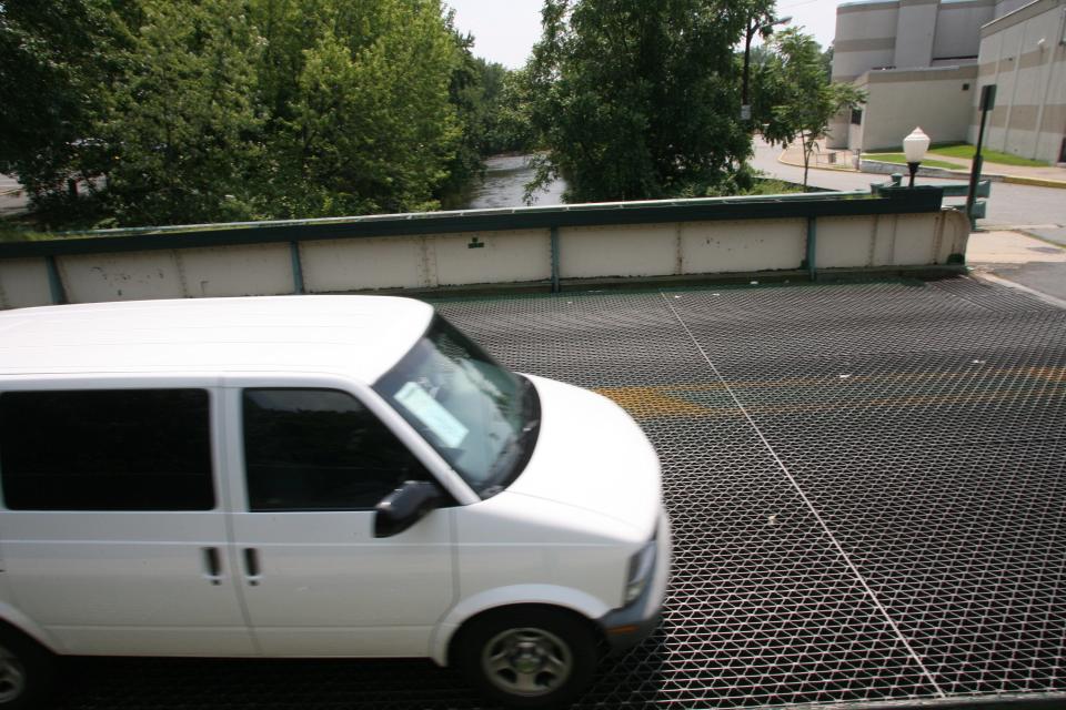 Cars pass through the Passaic Avenue bridge that crosses over Saddle River in Lodi, NJ. pictured on July 19, 2008.