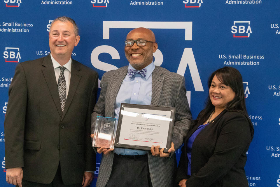 Stacey Poynter, left, U.S. Small Business Administration's Indiana District director, honors Dr. Klein Ileleji, cofounder and CEO of JUA Technologies International LLC, with the award for Indiana and Great Lakes Region Exporter of the Year. Geri Aglipay, U.S. Small Business Administration's Great Lakes regional administrator, joined the celebration, on May 5, 2022, in West Lafayette. JUA Technologies International created a solar food dehydrator.