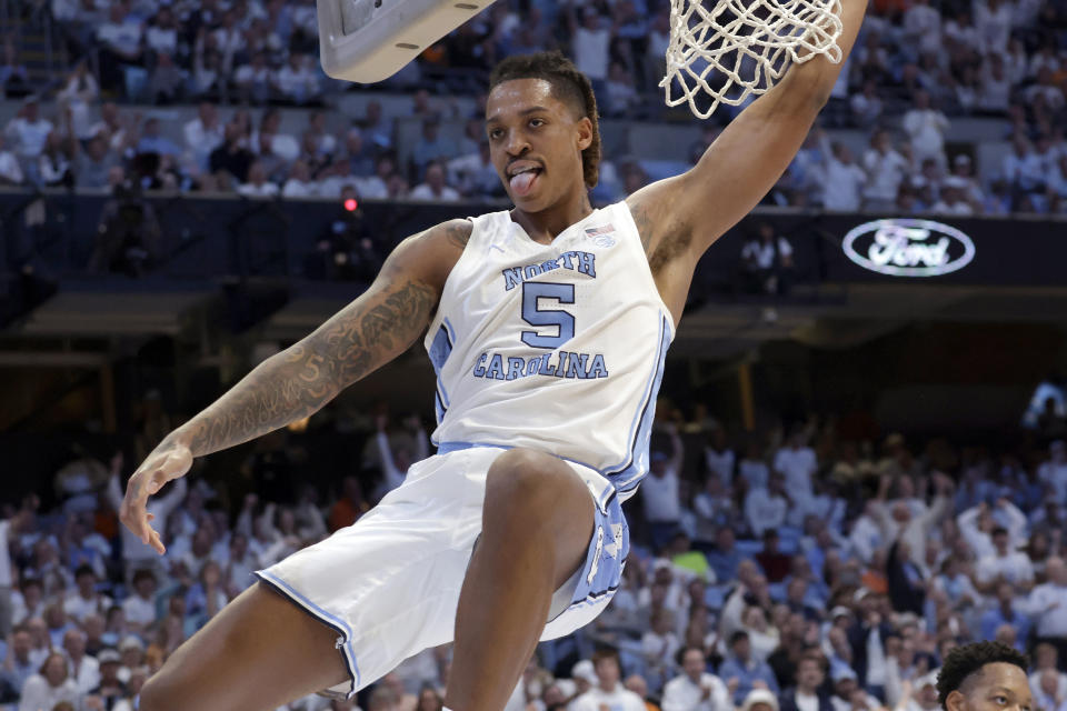 North Carolina forward Armando Bacot (5) reacts as he follows through on a dunk against Tennessee during the first half of an NCAA college basketball game Wednesday, Nov. 29, 2023, in Chapel Hill, N.C. (AP Photo/Chris Seward)