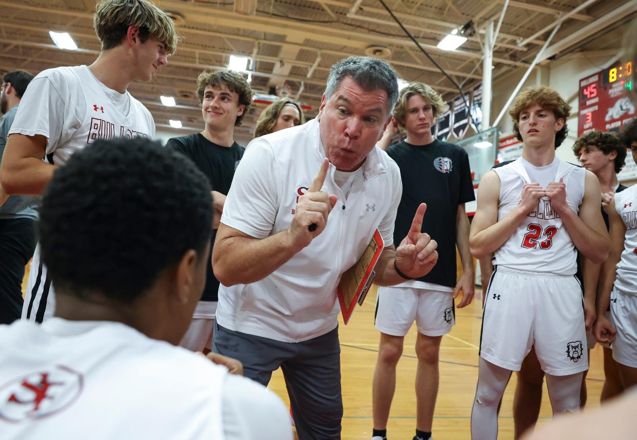 South Fork head coach Brian Flynn talks to his team during a timeout against St. Andrew's during the Bulldog Bash basketball tournament final, Friday, Jan. 5, 2024, at South Fork High School in Martin County. South Fork won 62-58.