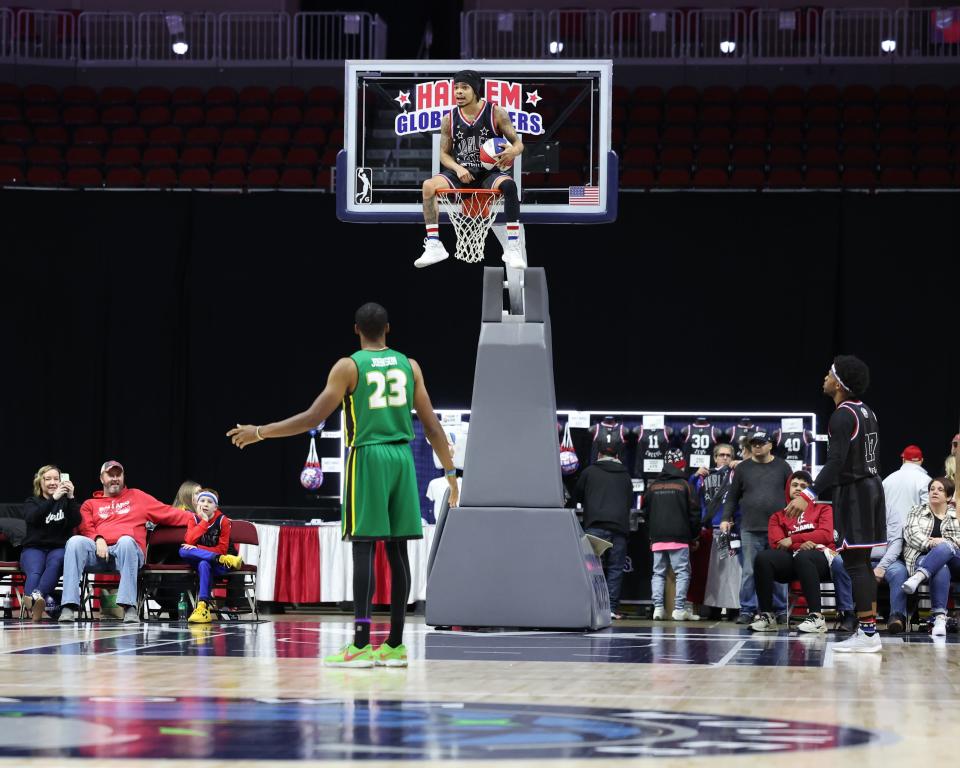 Harlem Globetrotters' Wham Middleton (40) plays defense from the top of the basket during the team's game with the Washington Generals at Wells Fargo Arena in Des Moines, Iowa.
