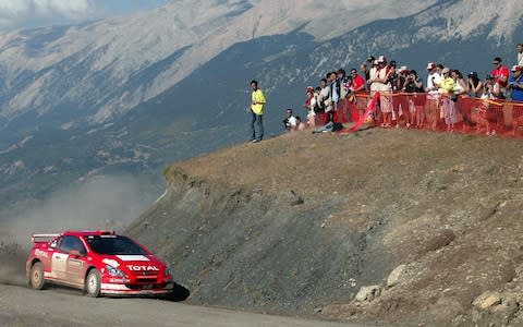 Marcus Gronholm of Finland drives his Peugeot 307 WRC during the Rally of Turkey in the Mediterranean coastal town of Kemer, southern Turkey, Friday June 25, 2004. The Rally of Turkey is the seventh leg of the World Rally Championship. (AP Photo/Str)  - Credit: AP