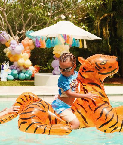 <p>Iggy Azalea/Instagram</p> Onyx on a tiger float in the swimming pool