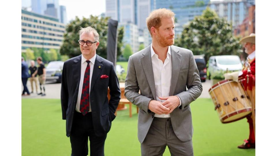 Prince Harry walking with Dominic Reid