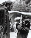 <p>Charlton Heston getting papped by an ape.</p>