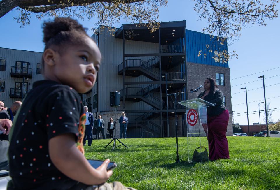 Terrence Ivory Jr., 3, sits to the side as his mom, Alexis Jones, talks about living in poor conditions as a mom but now about to live in the new Cherry Oak Apartments in Nashville, Tenn., Thursday, March 28, 2024.