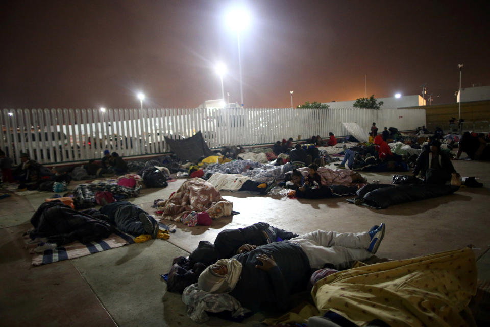 Members of a caravan of migrants from Central America sleep near the San Ysidro checkpoint along the United States border.