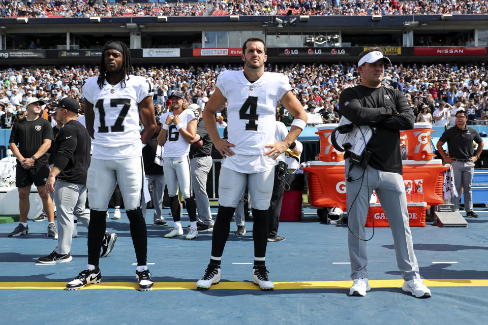 NASHVILLE, TN - SEPTEMBER 25: Davante Adams #17 Las Vegas Raiders, Derek Carr #4, and head coach Josh McDaniels of the Las Vegas Raiders stand on the sidelines prior to an NFL football game against the Tennessee Titans at Nissan Stadium on September 25, 2022 in Nashville, Tennessee. (Photo by Kevin Sabitus/Getty Images)