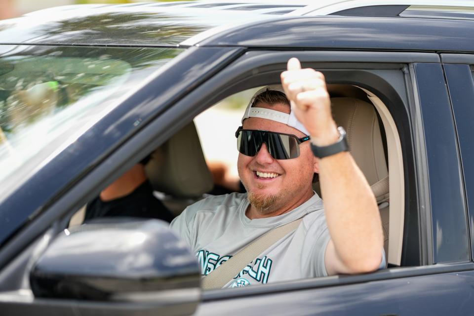 Family members and supporters gather at the school on May 22 to send off the Jensen Beach High School baseball team for the state championships.