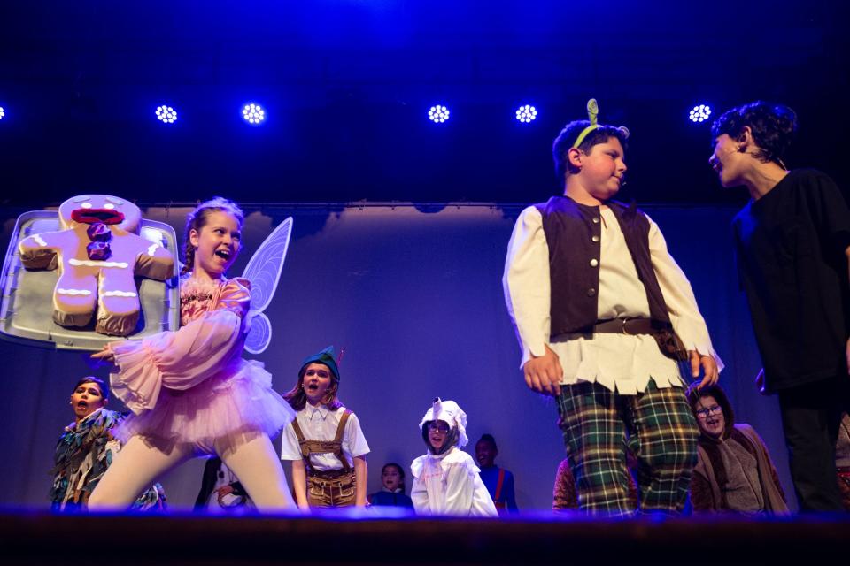 Elementary students performing in Shrek Jr. sing on stage during dress rehearsals at Metro Elementary on Thursday, March, 21, 2024, in Corpus Christi, Texas.