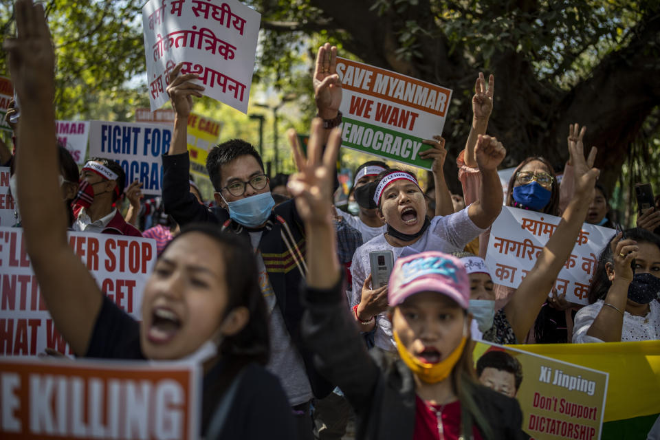 FILE - In this March 3, 2021 file photo, Chin refugees from Myanmar shout slogans during a protest against military coup in Myanmar, in New Delhi, India. Four Indian states bordering Myanmar have stepped up measures to prevent refugees from entering India through a porous border following last month's military coup in the Southeast Asian country, a government official said Saturday. (AP Photo/Altaf Qadri)