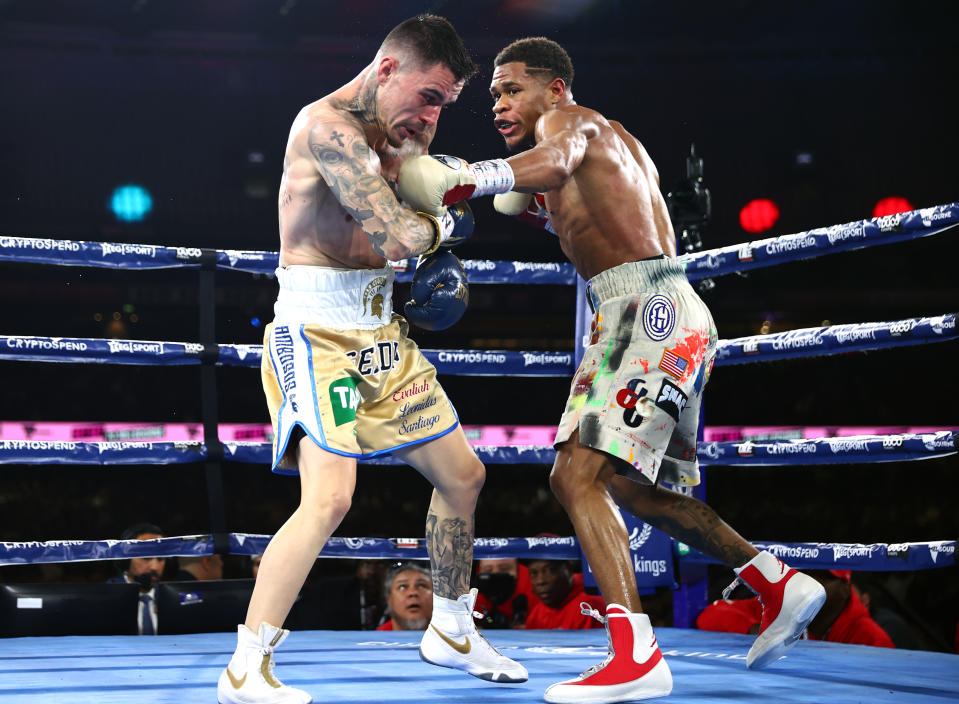 MELBOURNE, AUSTRALIA - JUNE 05: George Kambosos Jnr (L) and Devin Haney (R) exchange punches during their World Lightweight Undisputed Championship fight, at Marvel Stadium on June 05, 2022 in Melbourne, Australia. (Photo by Mikey Williams/Top Rank Inc via Getty Images)