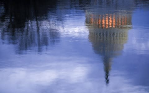 The U.S. Capitol is reflected in the Capitol Reflecting Pool before sunrise in Washington, DC - Credit: Aaron P. Bernstein/Bloomberg