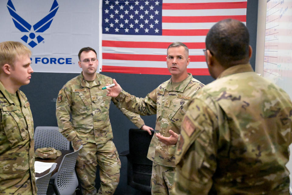 U.S. Air Force Master Sgt. Heath Ezelle, 25th Aerial Port Squadron operations training manager, conducts training for members at the start of a two-day exercise during the unit training assembly on March 11, 2023, at Maxwell Air Force Base, Alabama. This training was part of a multi-day exercise for member of 25 APS to learn to load and unload aircraft from the side.