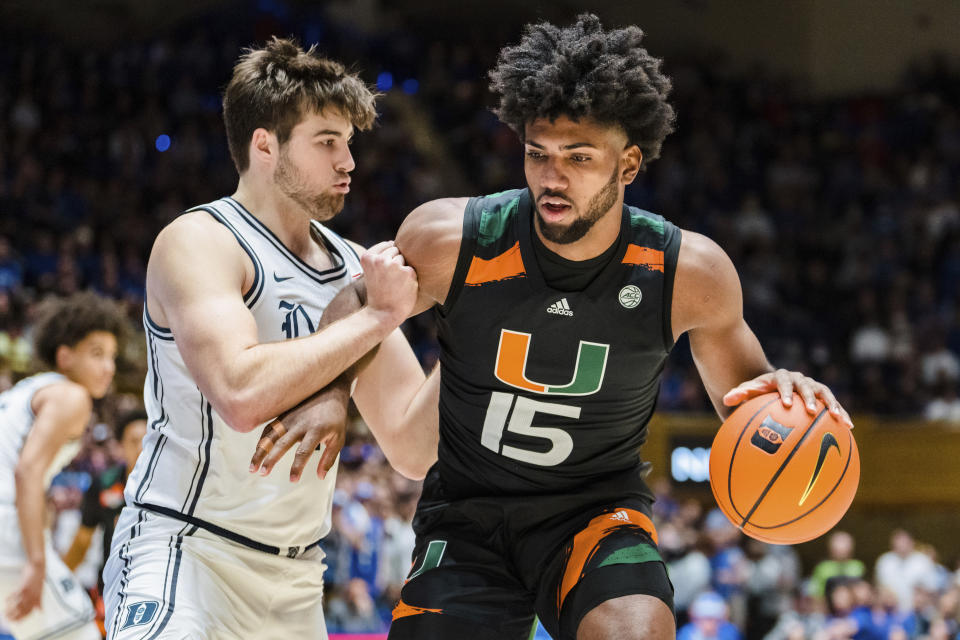 Duke center Ryan Young (15) guards Miami forward Norchad Omier (15) in the first half of an NCAA college basketball game on Saturday, Jan. 21, 2023, in Durham, N.C. (AP Photo/Jacob Kupferman)