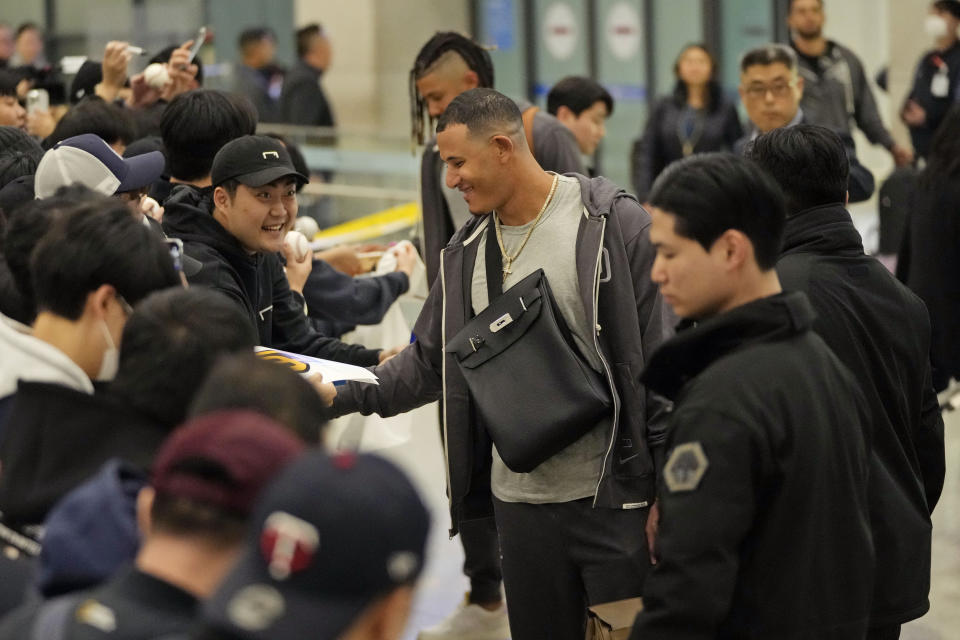 San Diego Padres player Manny Machado interacts with the crowd as he arrives at the Incheon International Airport In Incheon, South Korea, Friday, March 15, 2024. (AP Photo/Ahn Young-joon)