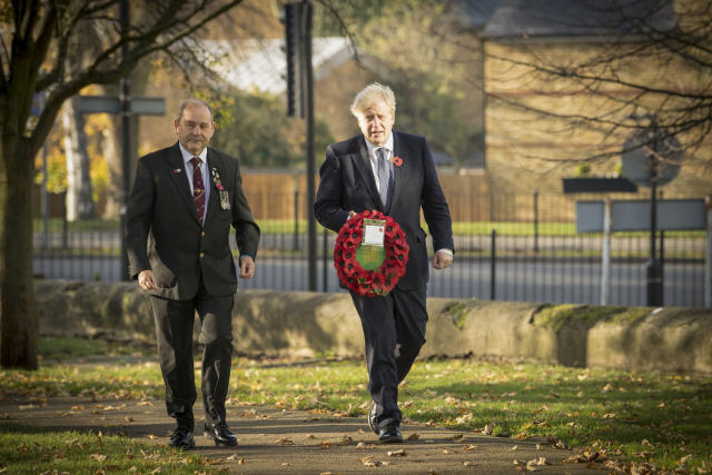 Prime Minister Boris Johnson (right), with Ian Ritchie from Hillingdon and District Royal British Legion, lay a wreath of remembrance at Uxbridge War Memorial in west London, ahead of Remembrance Sunday. (Photo by Stefan Rousseau/PA Images via Getty Images)
