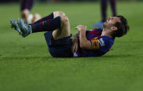 FC Barcelona's Lionel Messi looks painful injured during the Spanish La Liga soccer match between FC Barcelona and Sevilla at the Camp Nou stadium in Barcelona, Spain, Saturday, Oct. 20, 2018. (AP Photo/Manu Fernandez)