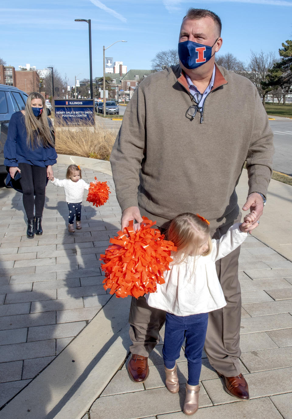 University of Illinois' new football coach Bret Bielema and his family, wife Jen and daughters Briella, front, and Brexli were introduced to the media outside the Smith Center on UI campus in Champaign, Ill. on Sunday, Dec. 20 , 2020. (Robin Scholz/The News-Gazette via AP)