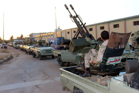 Military vehicles of members of the Libyan internationally recognised government forces head out from Misrata to the front line in Tripoli, Misrata, Libya May 10, 2019. REUTERS/Ayman Al-Sahili